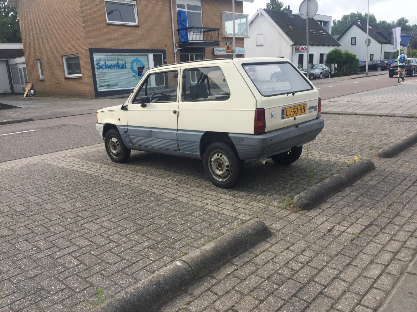 Compact hatchback with two-tone side panels and rear hatch