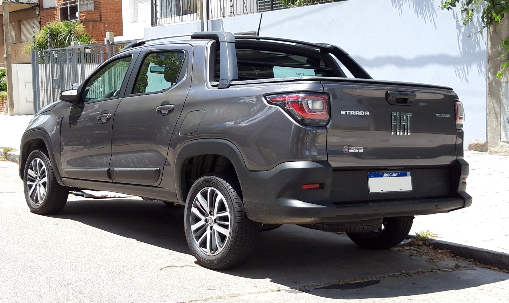 Rear view of a gray double cab pickup with alloy wheels
