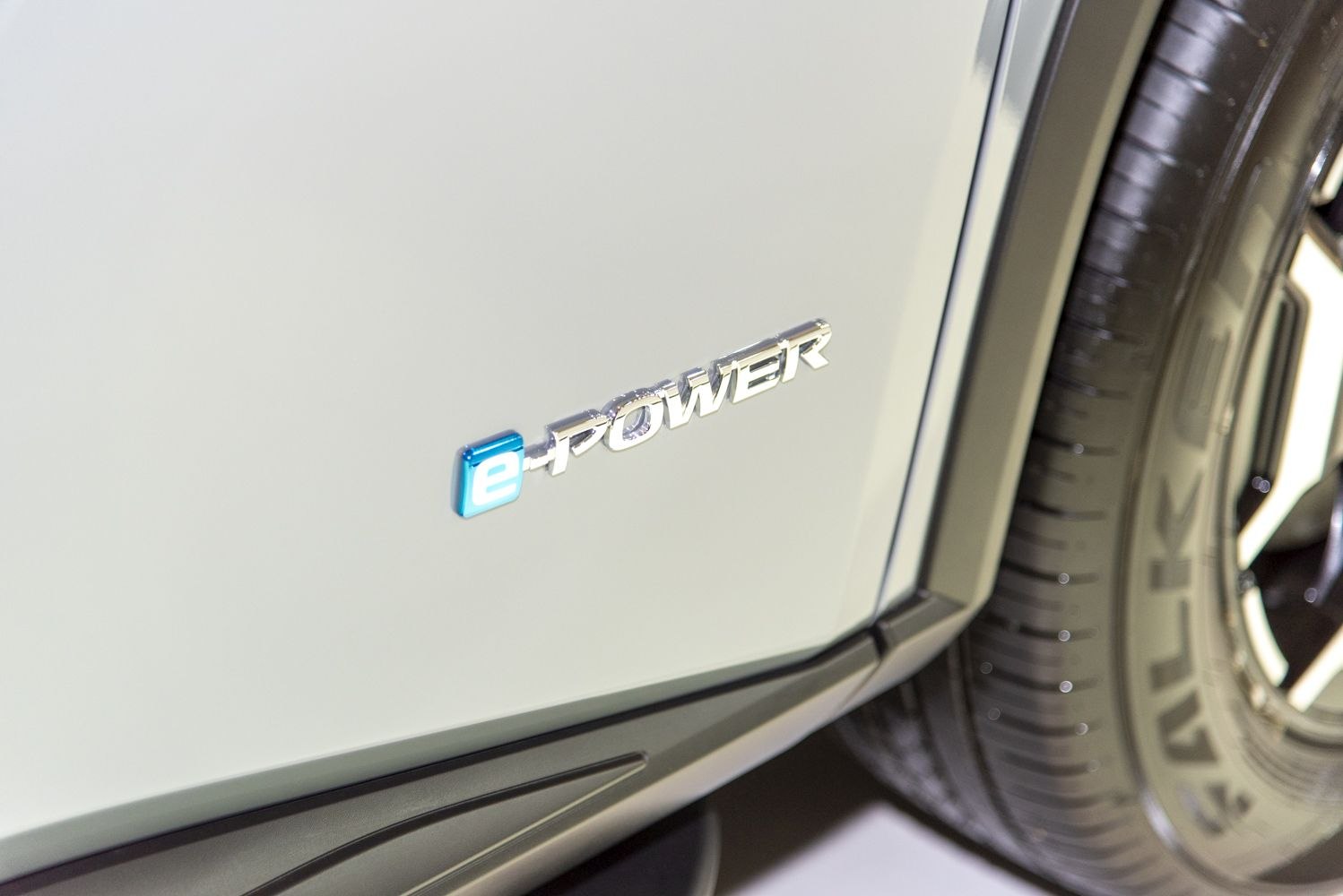 Close-up of e-POWER badge with tire and alloy wheel detail
