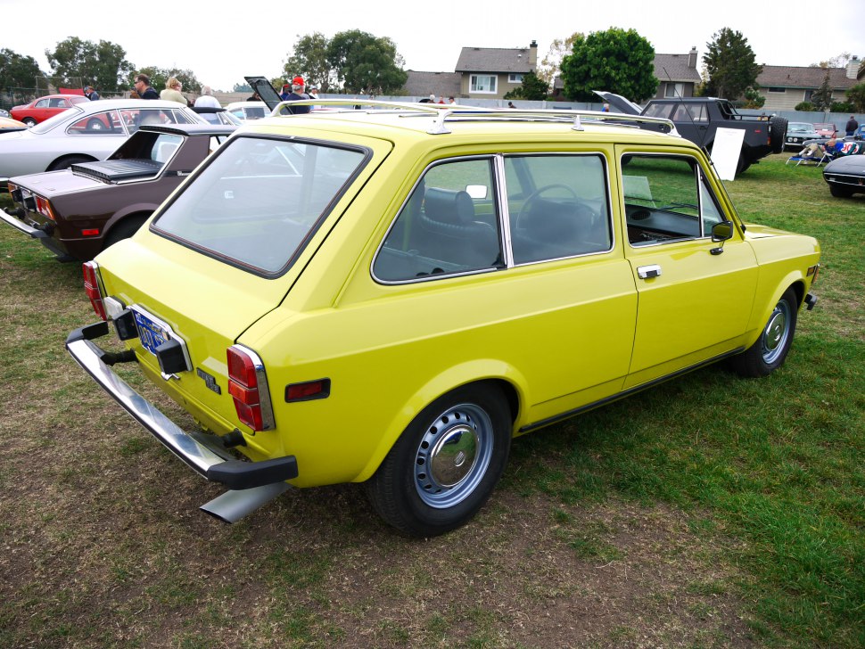 Yellow classic station wagon with roof rails and rear view