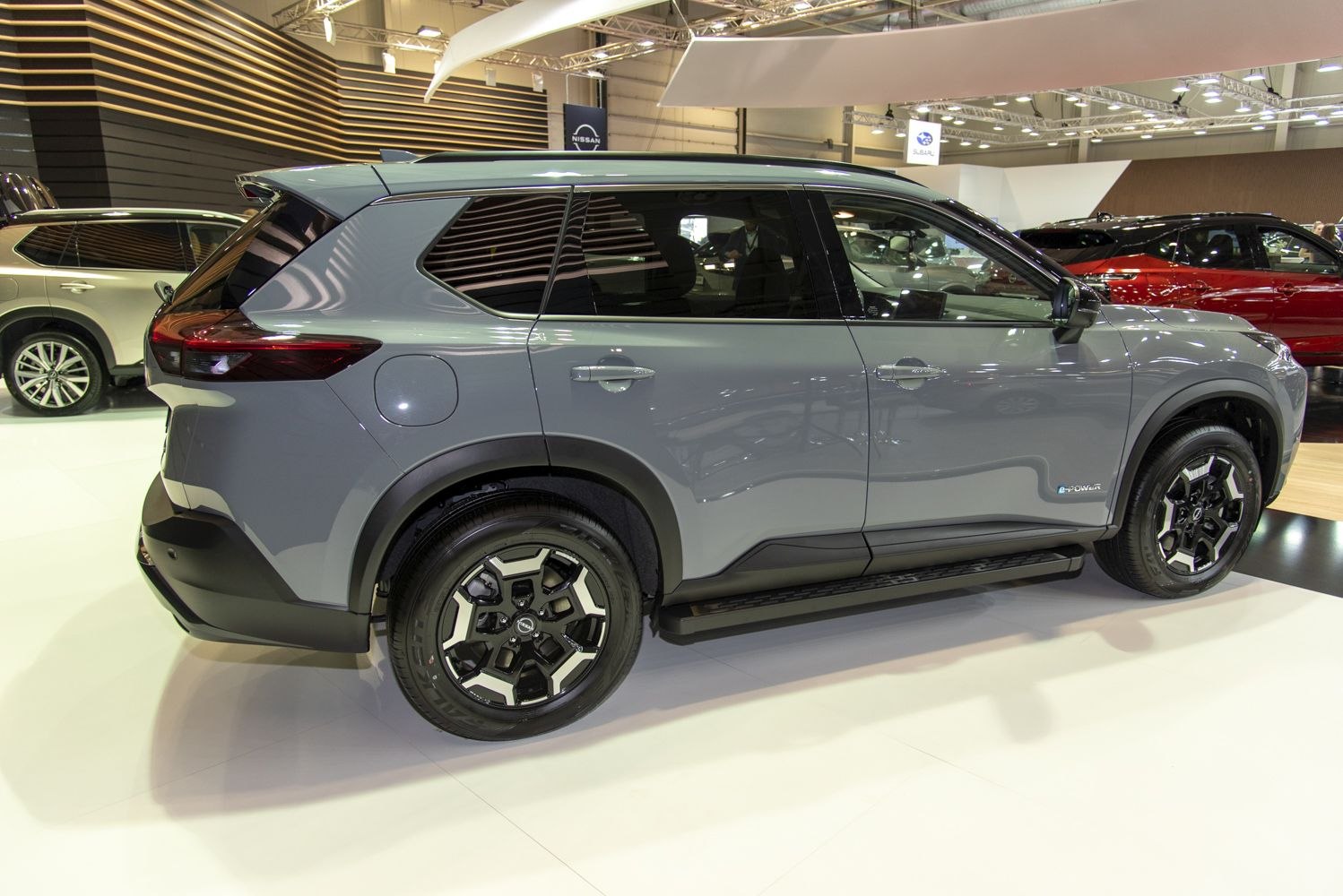 Gray SUV side profile with alloy wheels and tinted windows