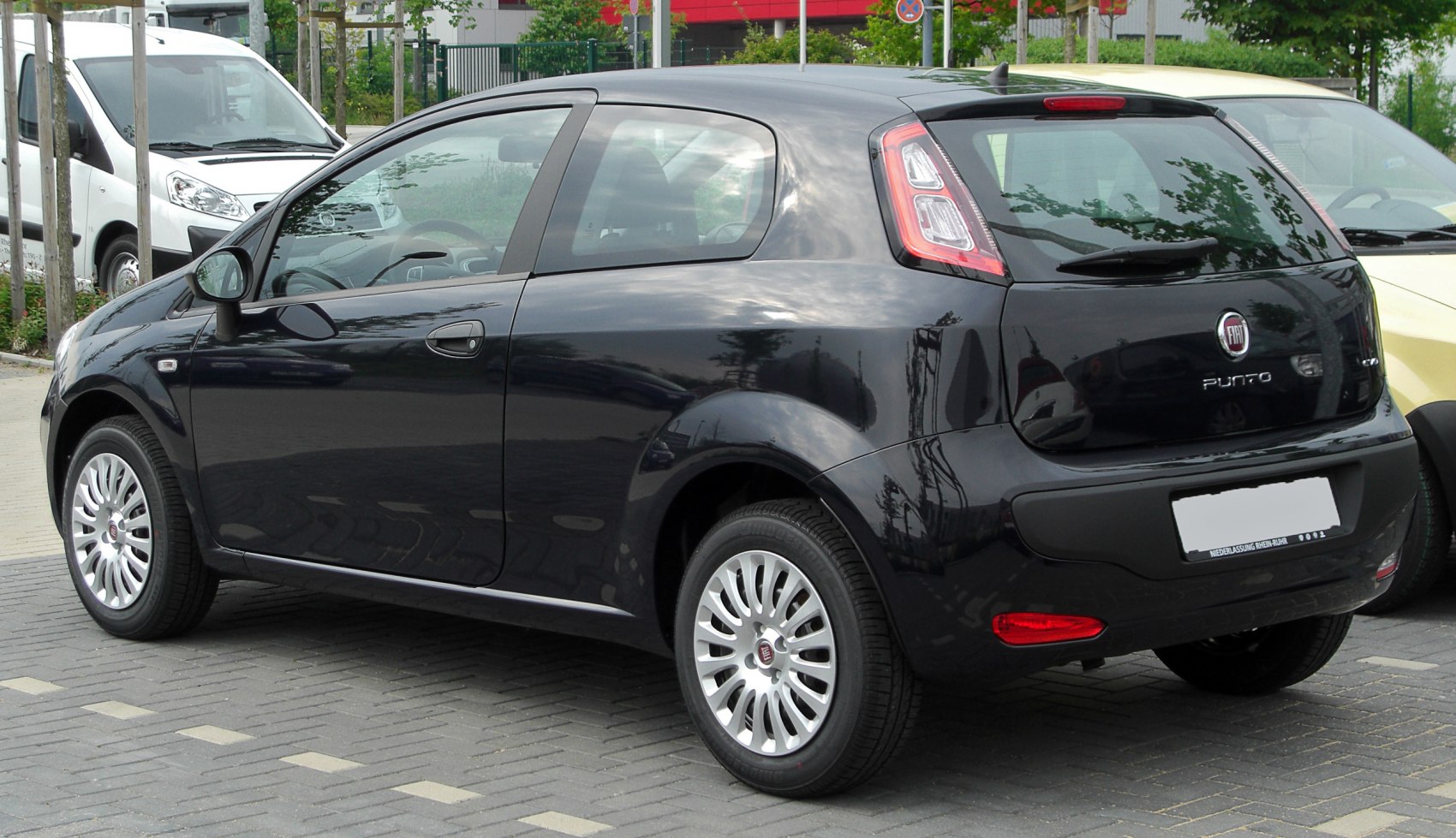 Rear side view of compact hatchback with distinctive taillights