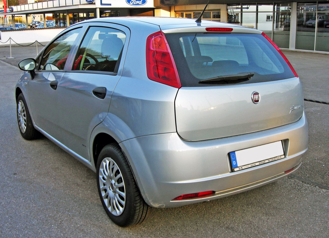 Silver hatchback rear with vertical red tail lights and five-door layout
