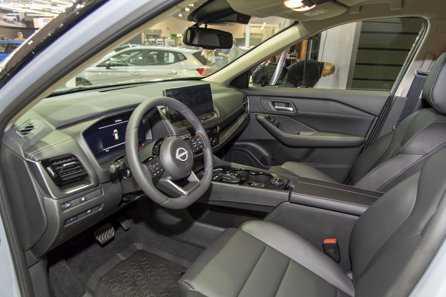 Modern car interior with dashboard and touchscreen display.