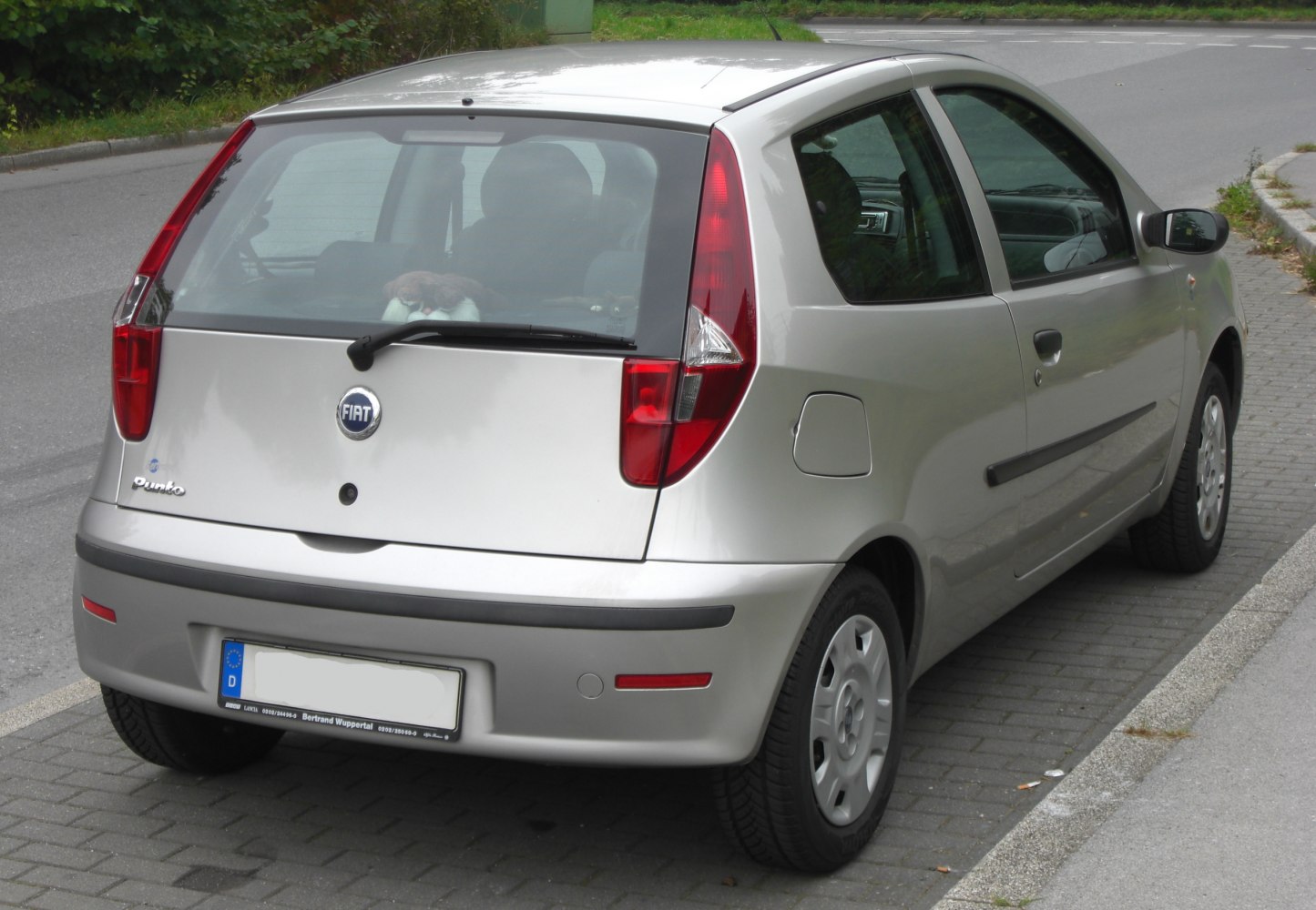 Rear view of a 3-door hatchback highlighting taillights and rear design