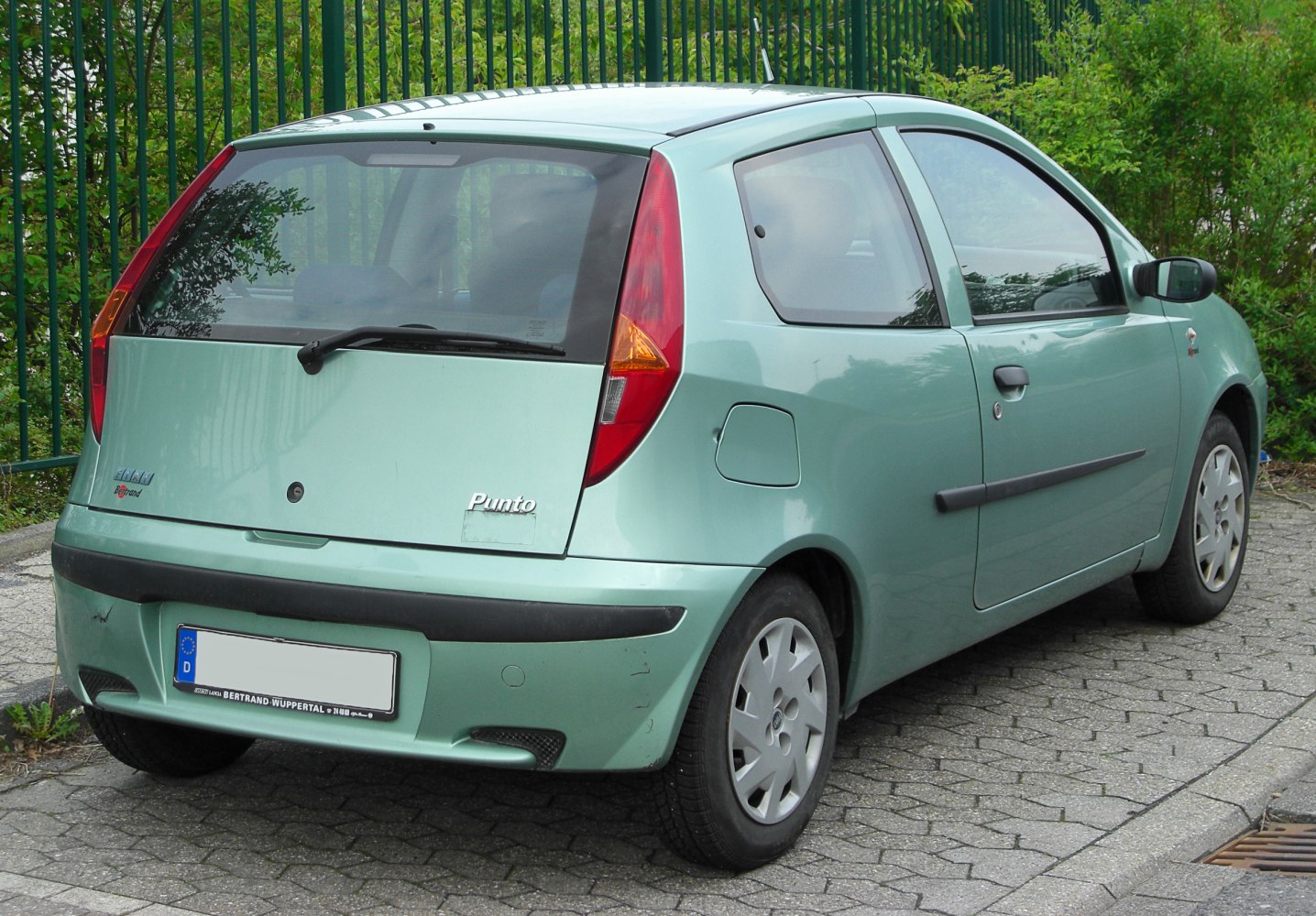 Rear of compact 3-door hatchback with vertical taillights and rear windshield wiper