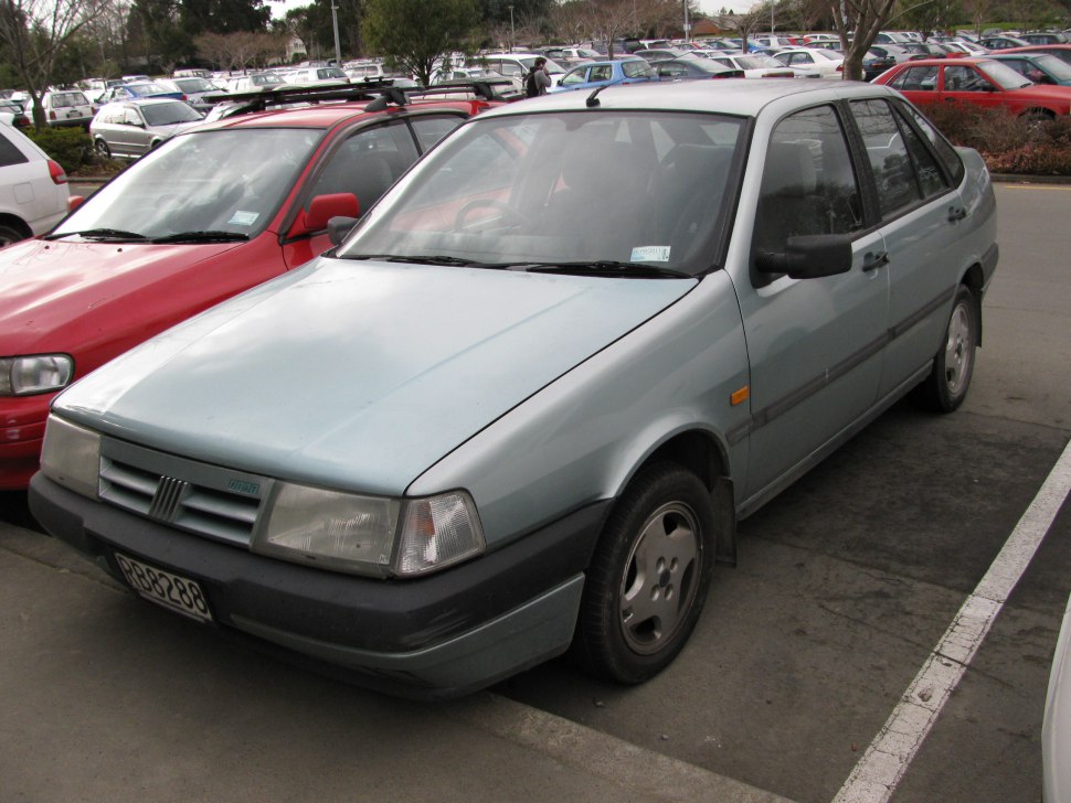 Front angle view of a vintage sedan with boxy headlights and classic grille.