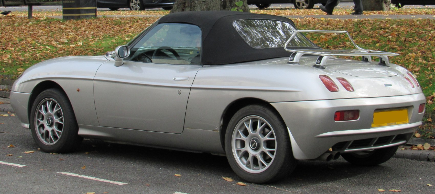 Convertible with soft foldable roof and rear chrome luggage rack