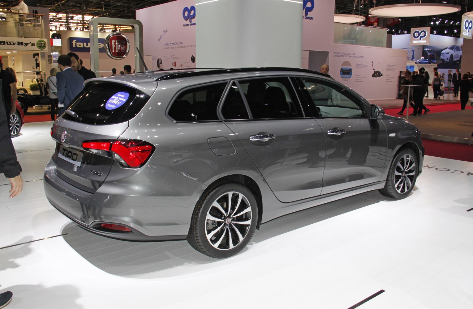 Rear-side view of sleek station wagon with distinctive taillights and alloy wheels