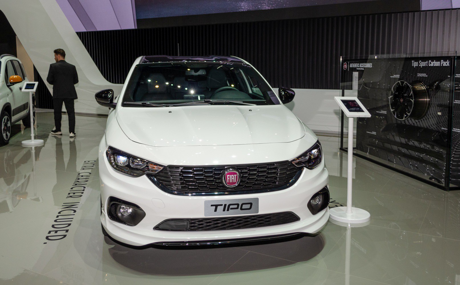 Front view with sleek headlights and grille of a modern hatchback car.