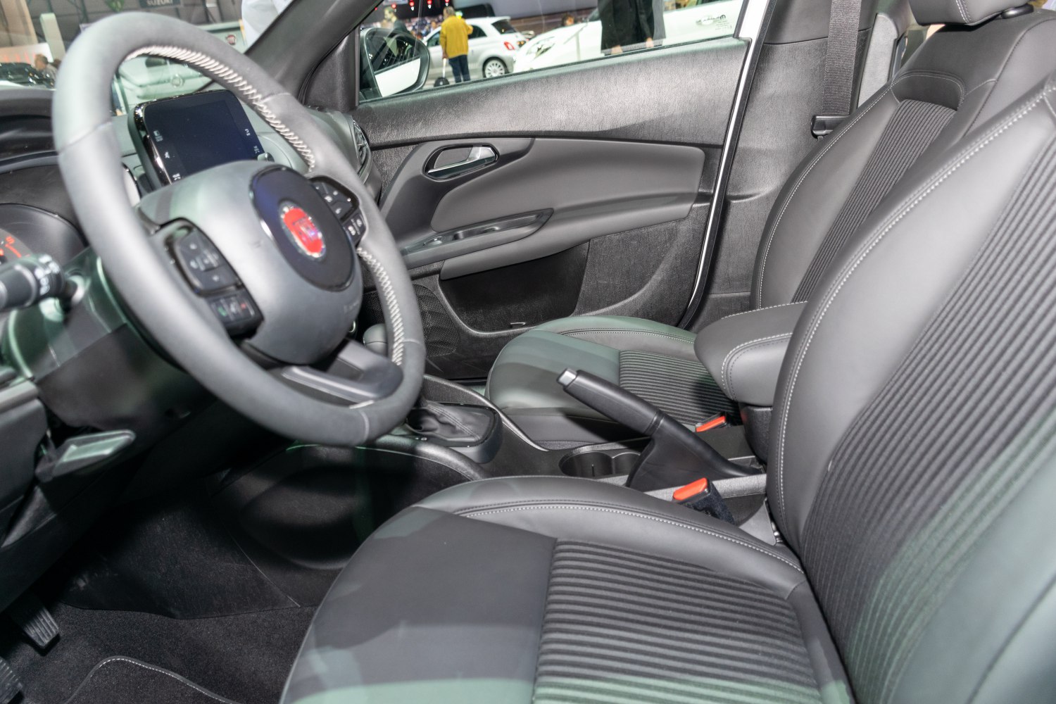 Close-up of car seats, steering wheel, and dashboard interior