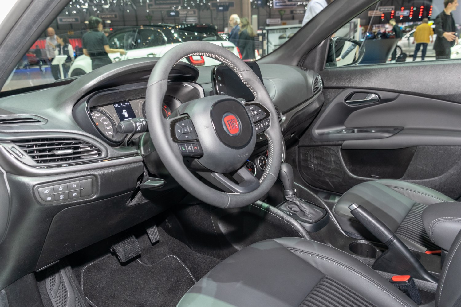 Steering wheel, dashboard, center console with gear shift and handbrake