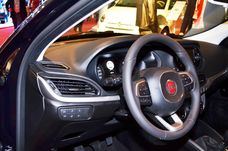 Dashboard and multifunction steering wheel controls in a modern car interior