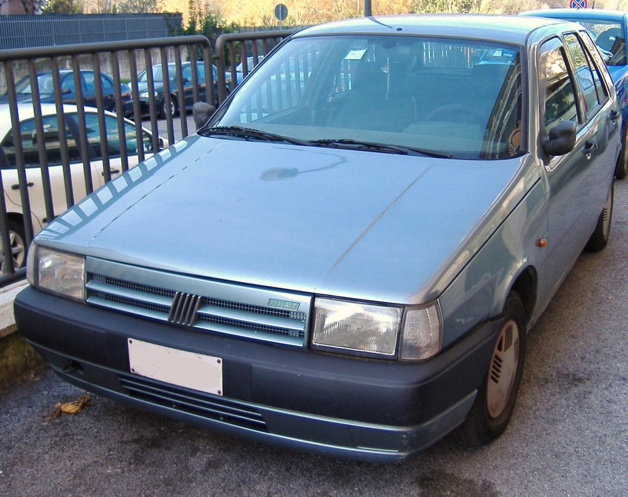 Front view with square headlights and classic grille.