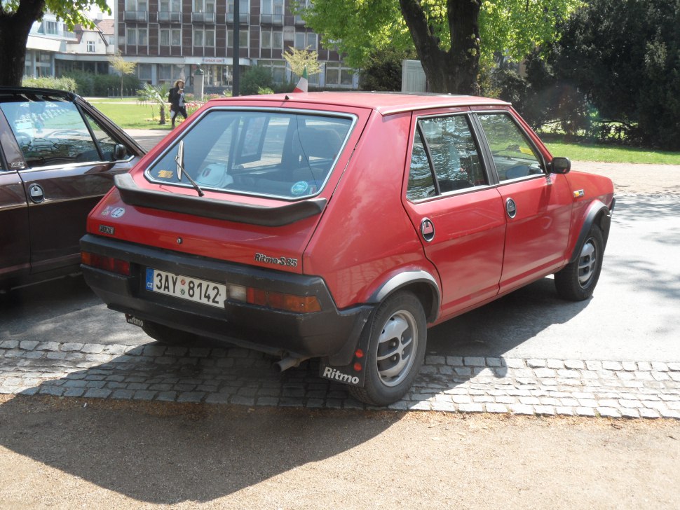 Rear view hatchback with spoiler and mudflaps