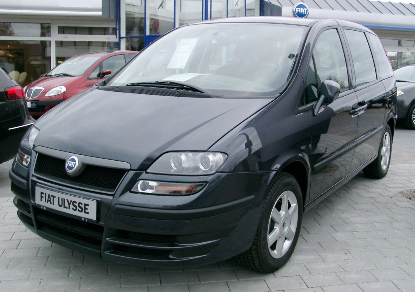 Black MPV with distinctive front headlights and grille design