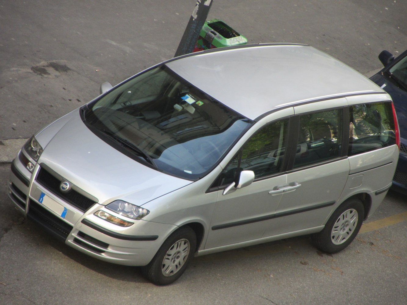 Silver minivan with front-side view and sleek contours