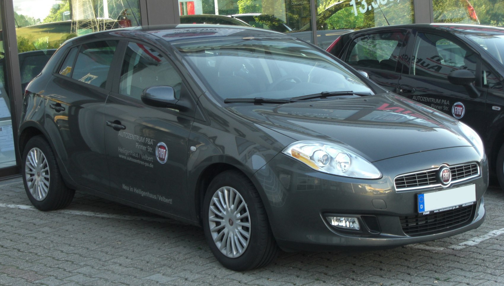 Front and side view of a compact hatchback with alloy wheels