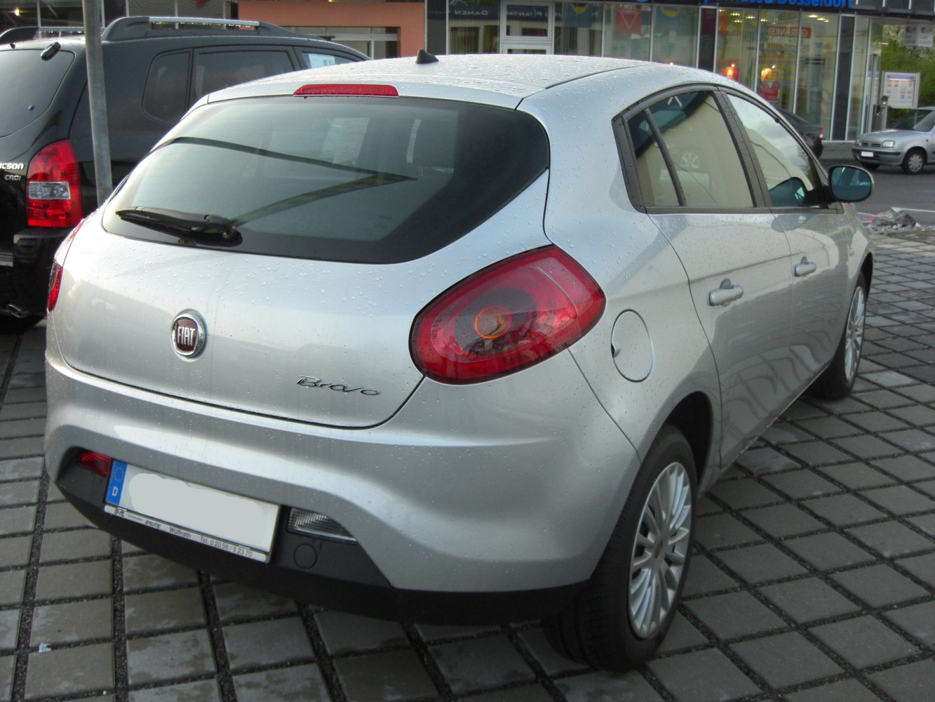 Compact hatchback rear with distinctive tail lights and rear window