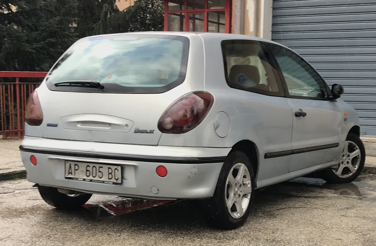 Rear hatch and taillight design of a small hatchback.