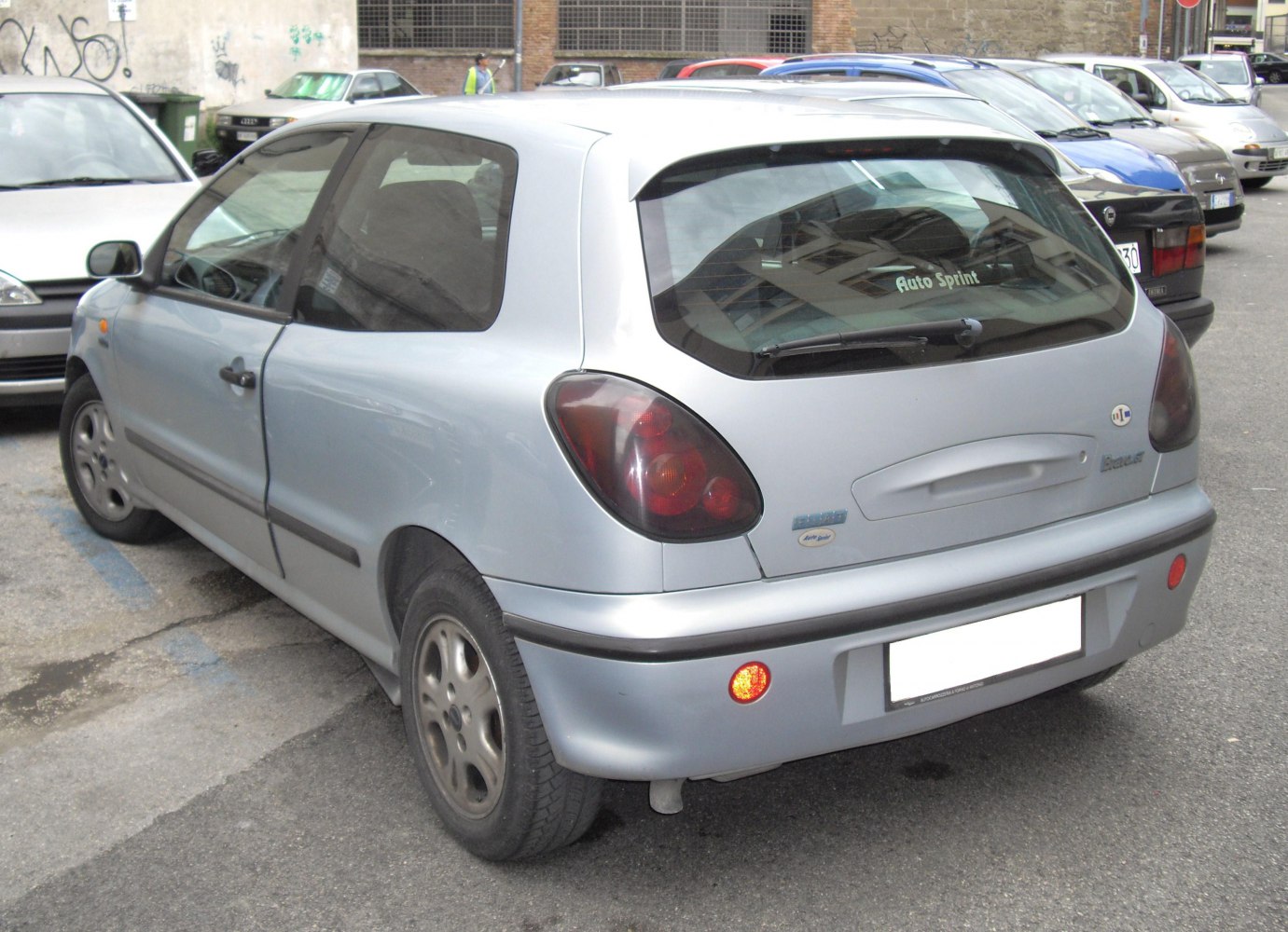 Rear view of a compact hatchback with distinct tail lights and rear windshield