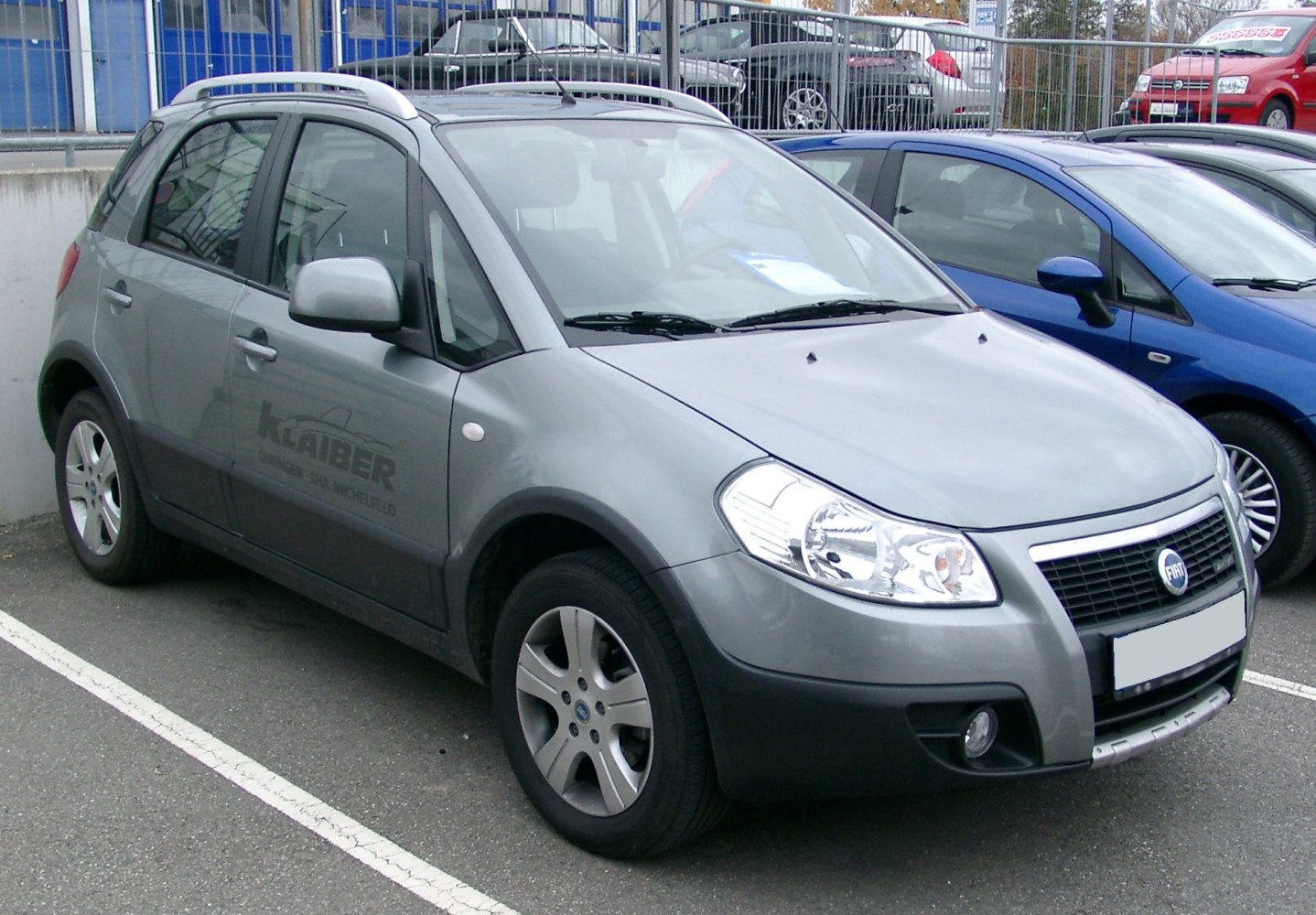 Front-side view of compact SUV with roof rails and alloy wheels