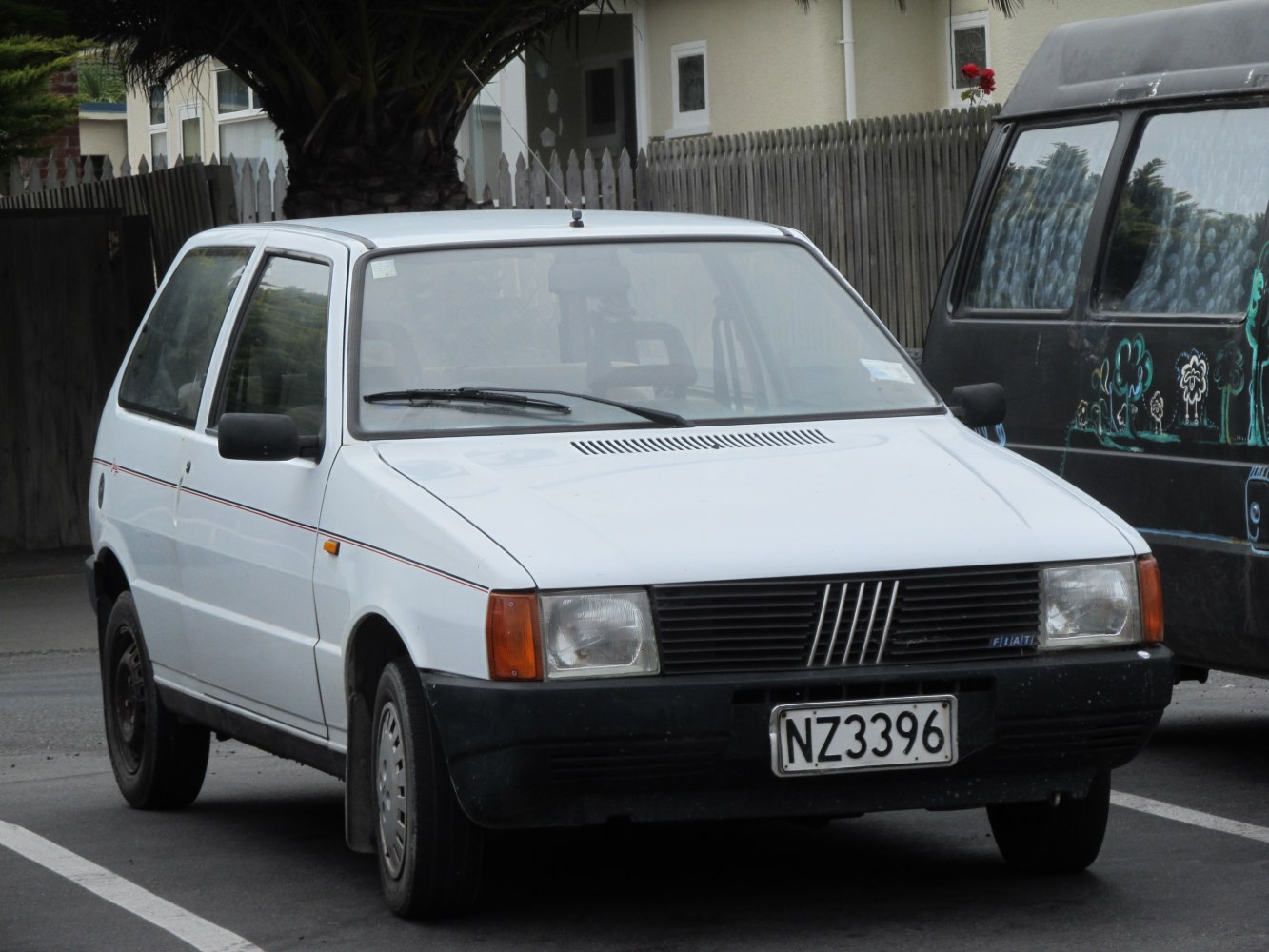 Front view of compact hatchback with rectangular headlights.