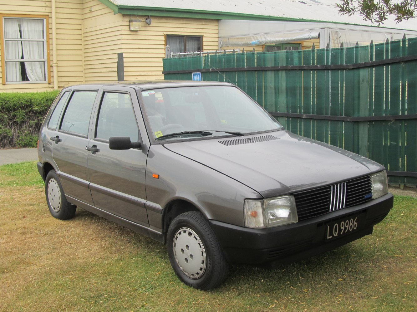 Classic hatchback front side view with square headlights and distinctive grille