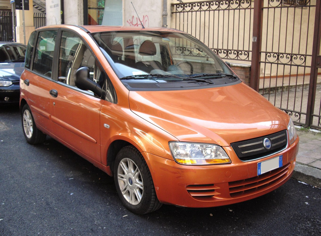 Compact MPV front with modern headlights and aerodynamic body