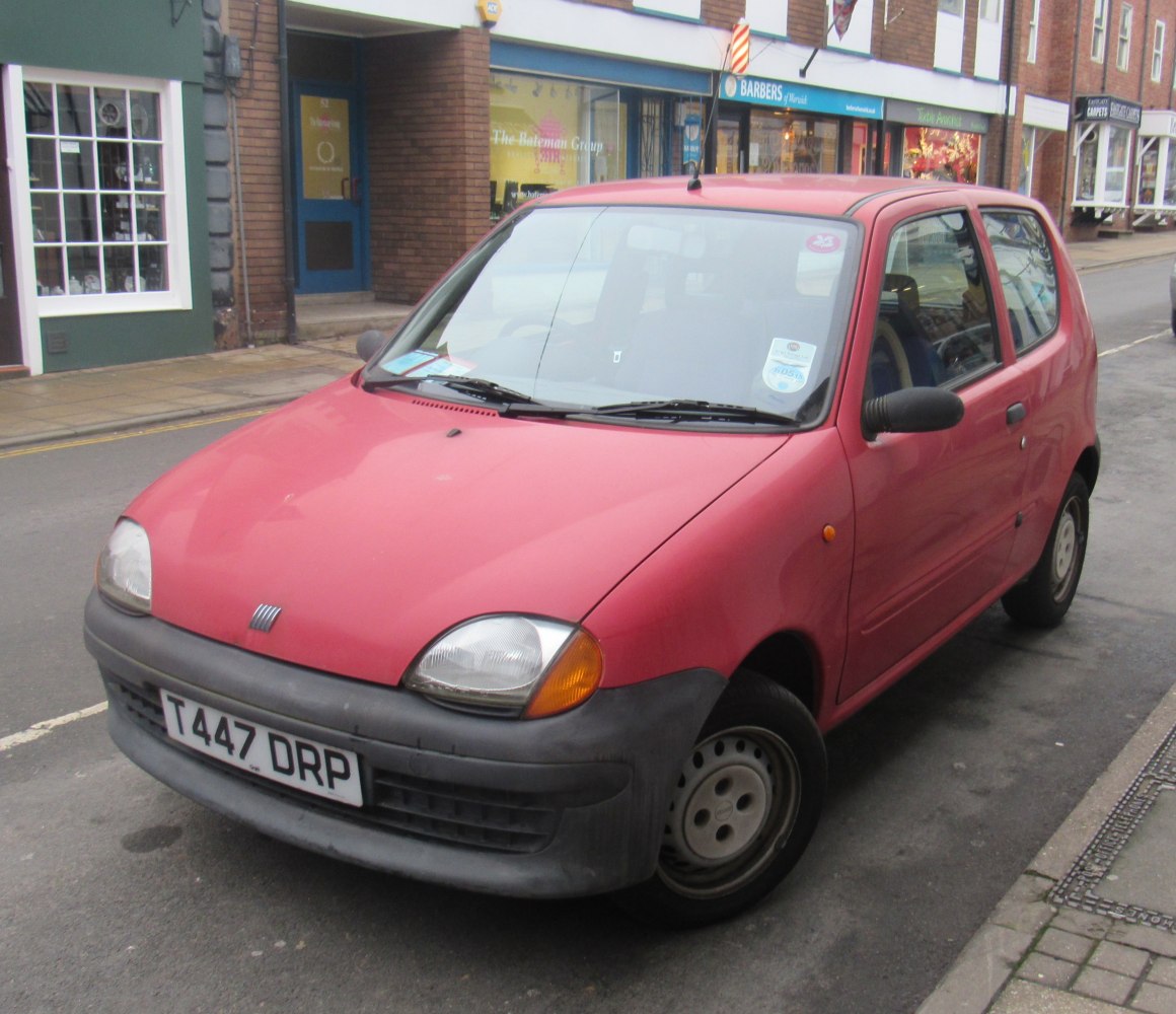 1998 compact hatchback with rounded headlights and black bumper
