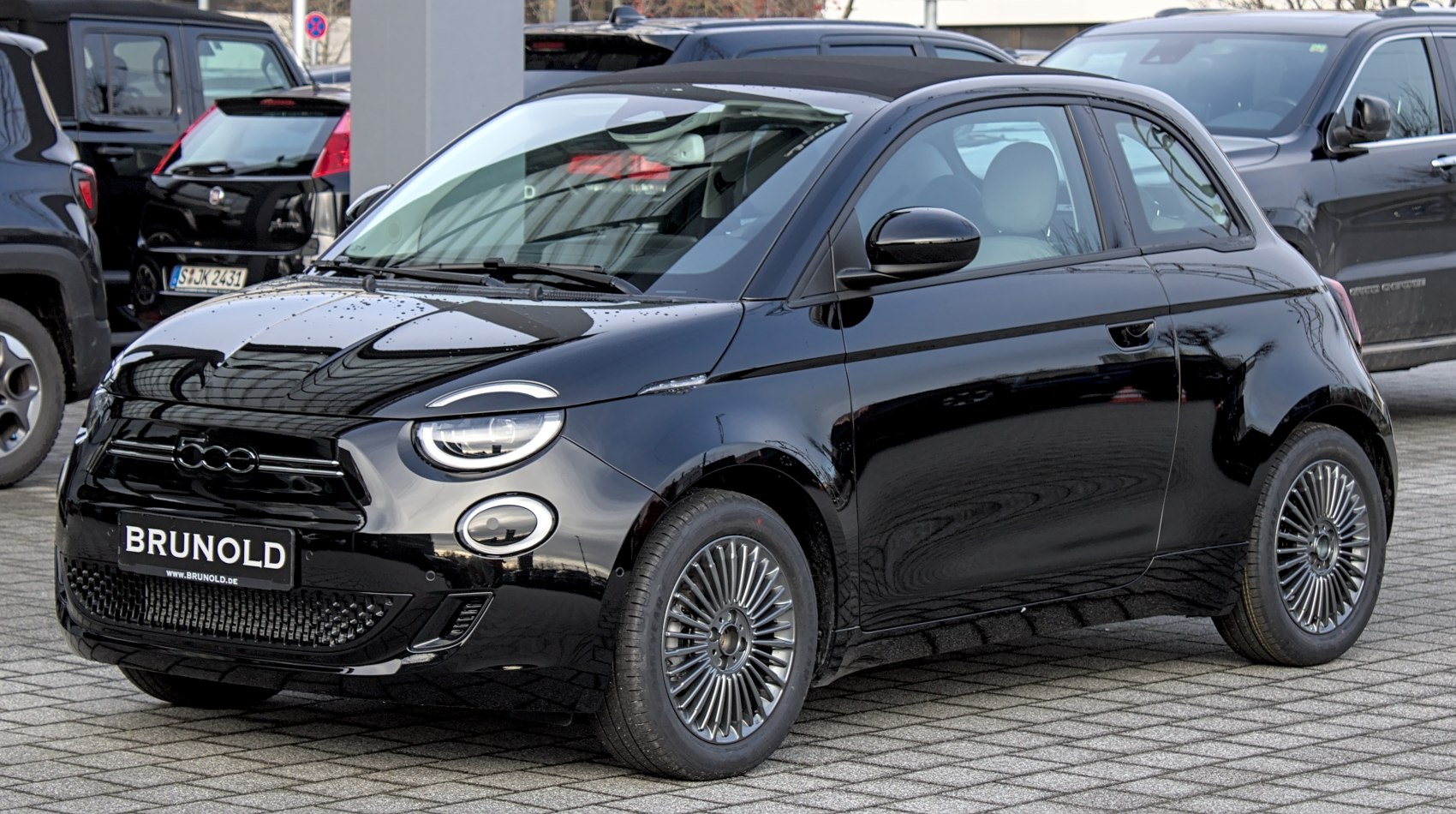 Black 2020 electric hatchback with round LED headlights and aerodynamic design
