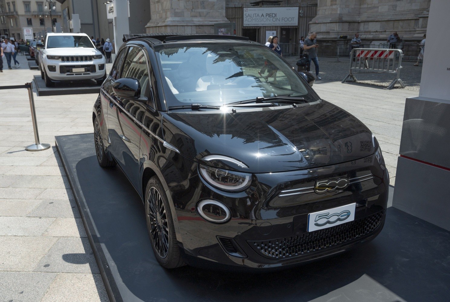 Black electric compact convertible with round LED headlights front view