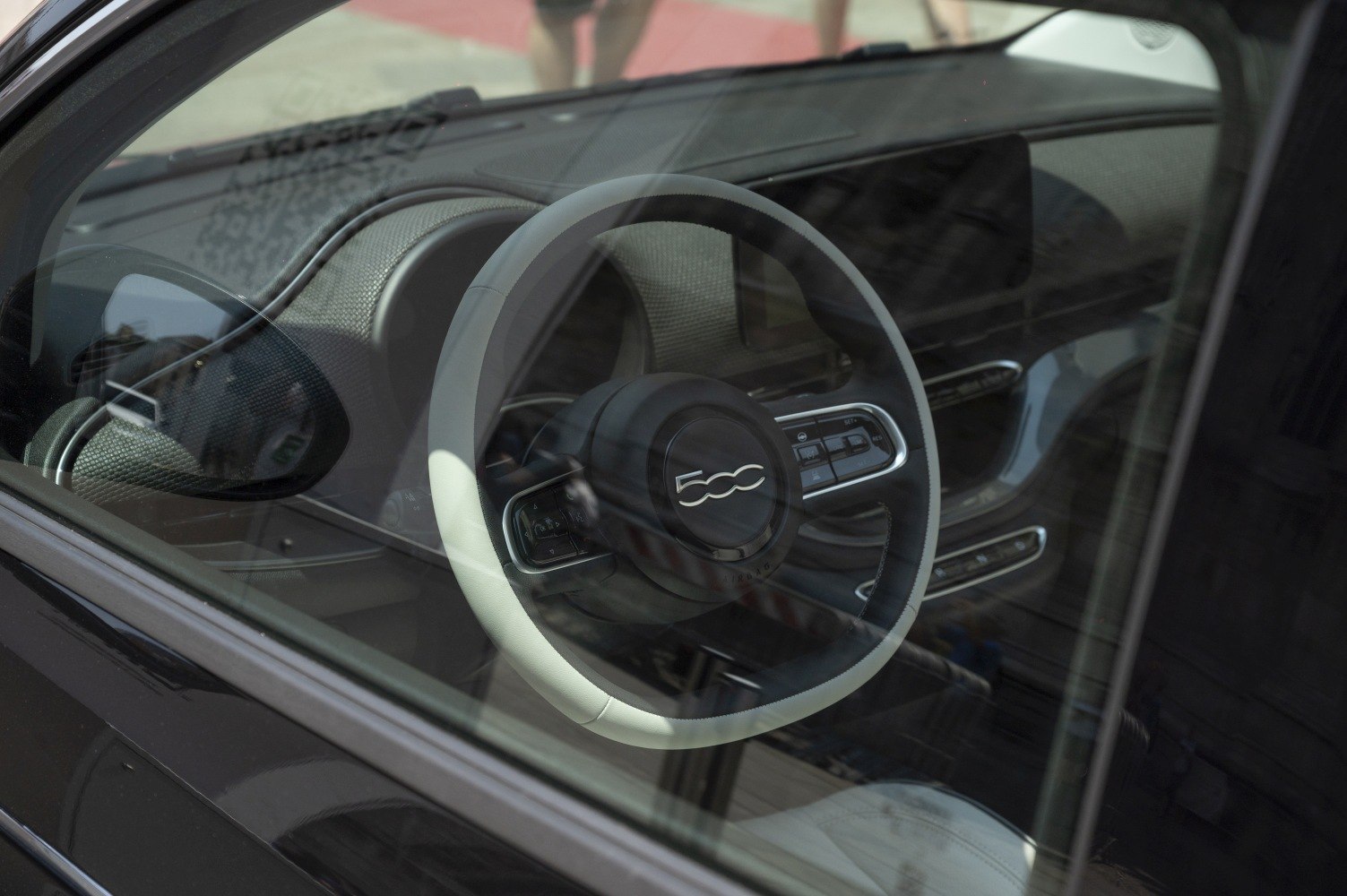 Modern Fiat 500e steering wheel and dashboard controls