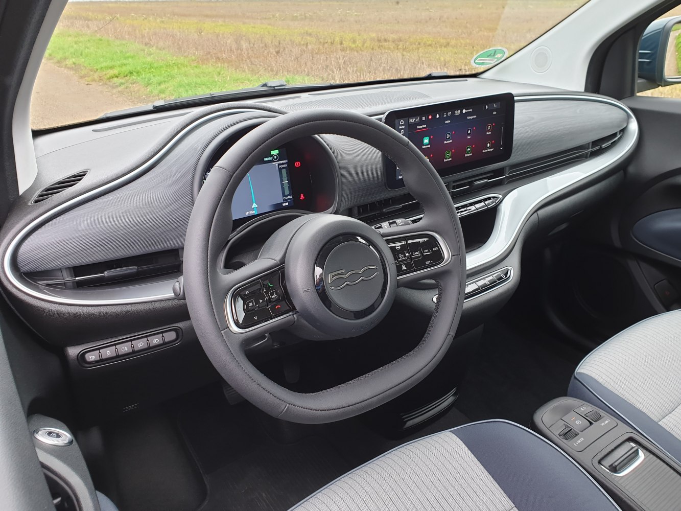 Electric car dashboard and steering wheel with digital displays