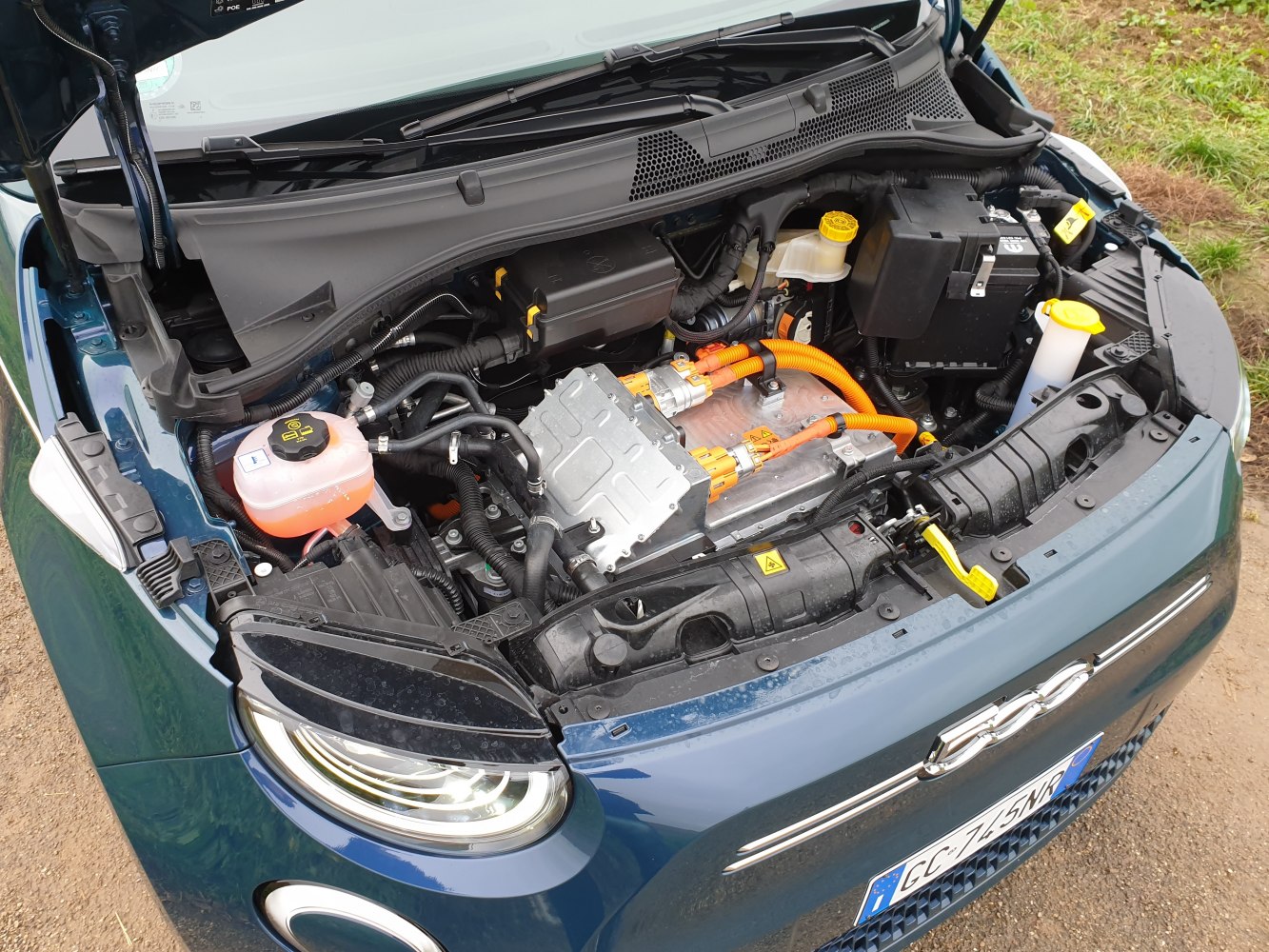 Electric powertrain and engine bay with high-voltage orange cables