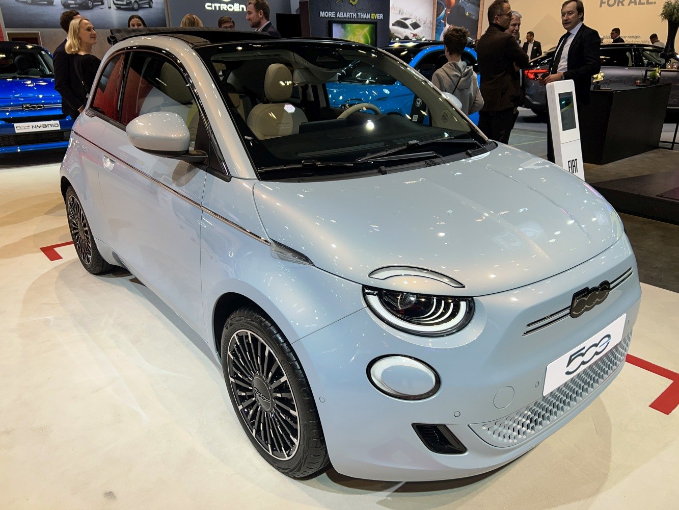 Compact electric city car with distinctive LED headlights and modern front grille
