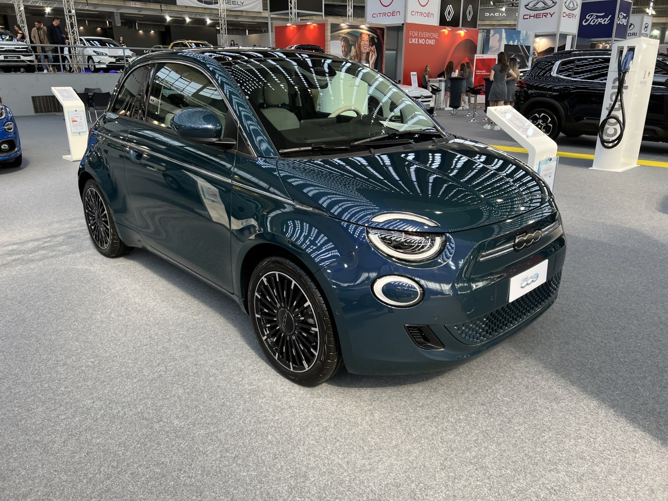 Front three-quarter view of a modern compact electric car with LED headlights