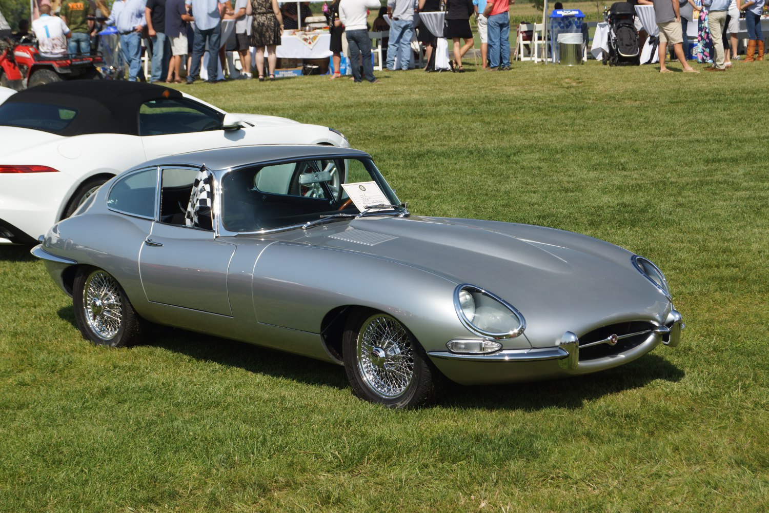 Silver classic coupe with wire wheels and chrome bumpers