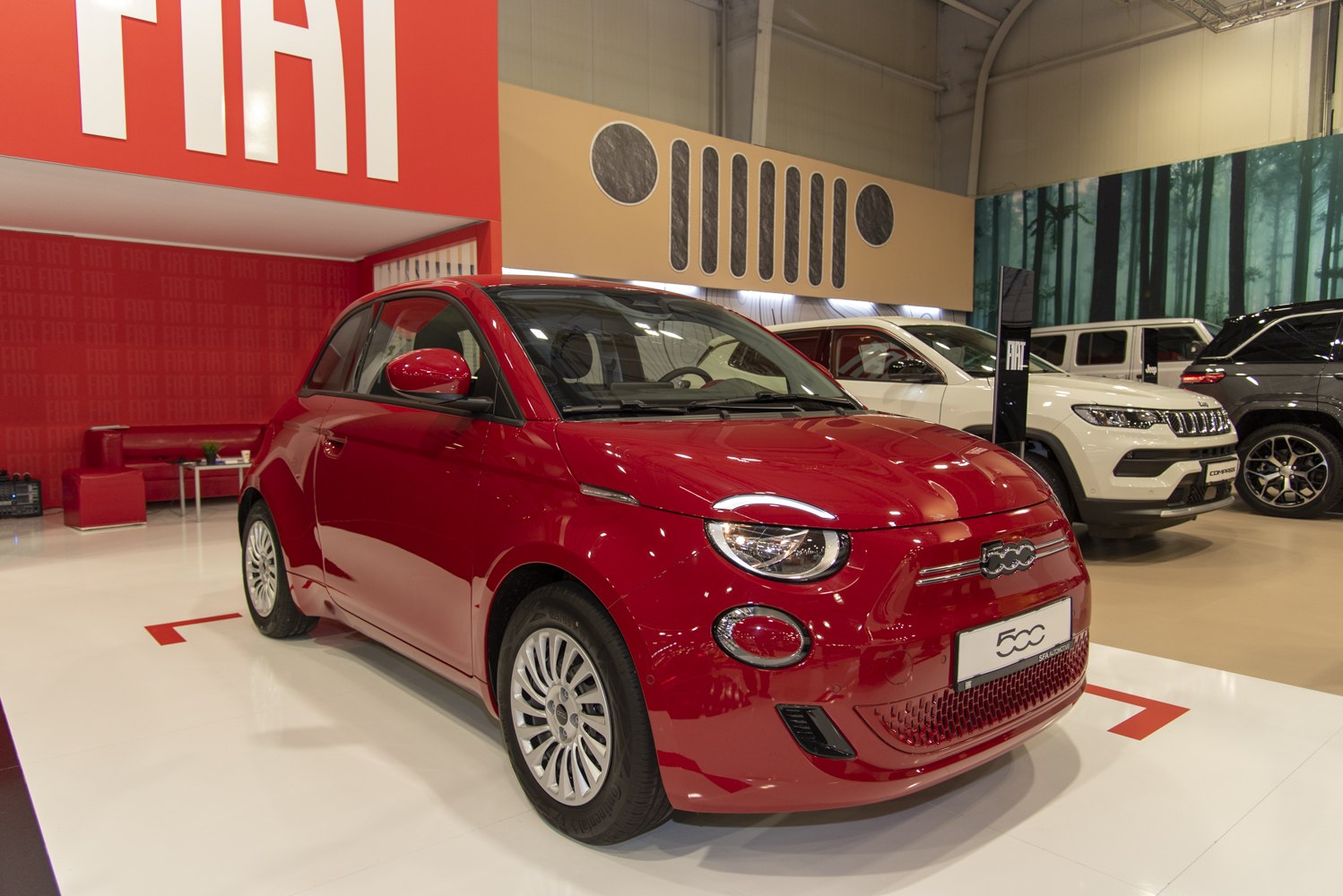 Red compact electric hatchback with modern headlights