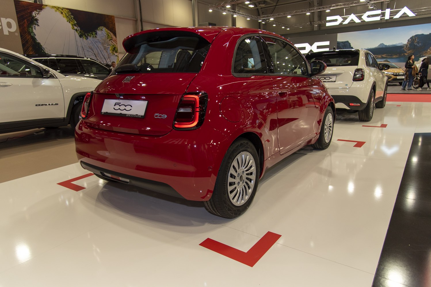 Rear view of a compact electric hatchback with distinctive tail lights.