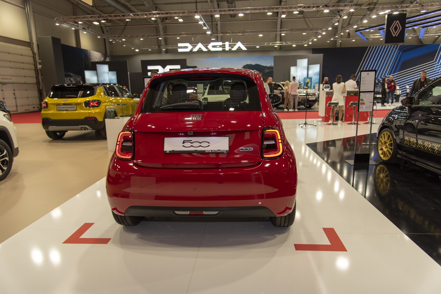 Rear view of a red hatchback with LED taillights.