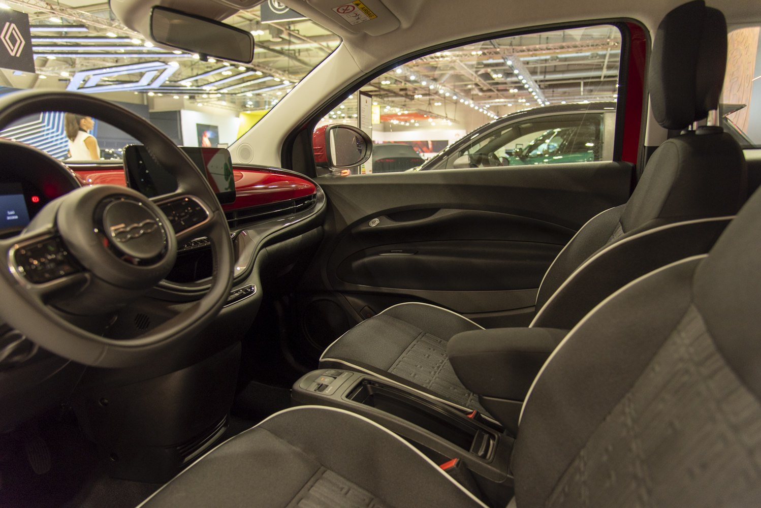 Modern dashboard and front seats with red dash trim