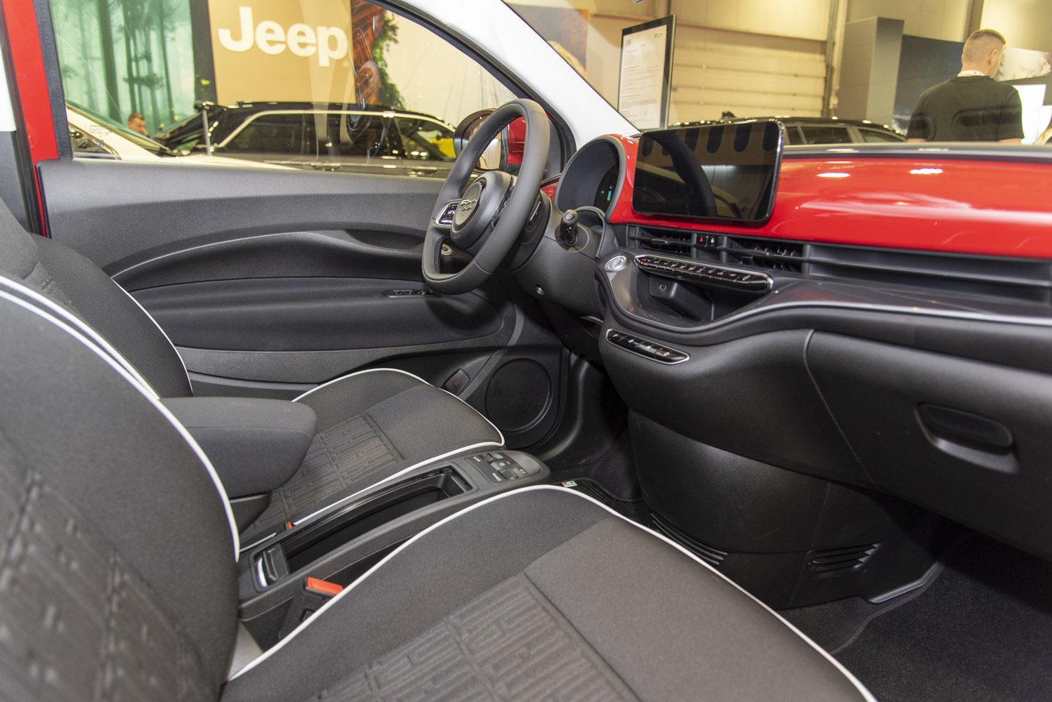 Fiat 500e electric car interior with digital dashboard and front seats