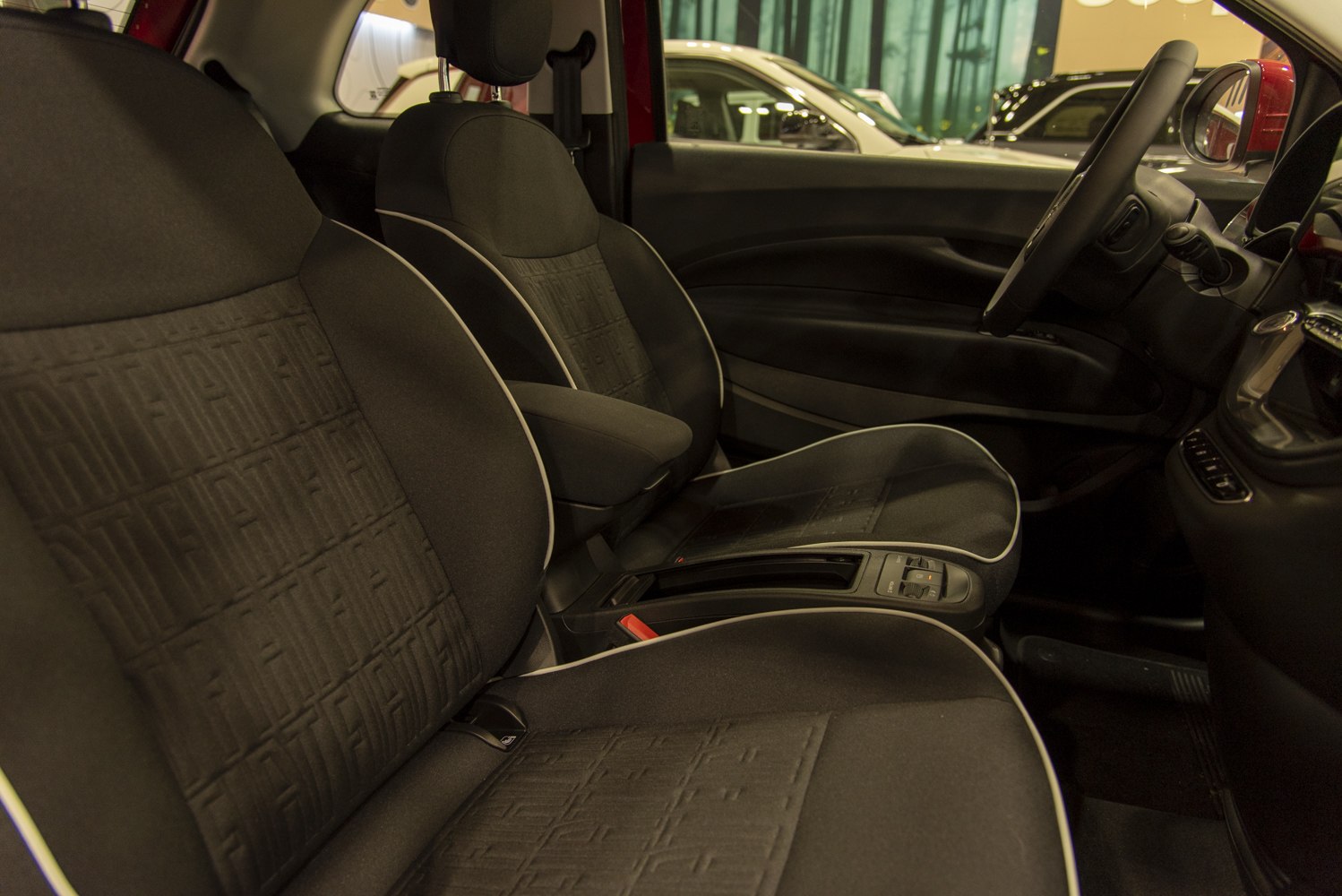 Fabric seats with embossed pattern and ergonomic cabin interior