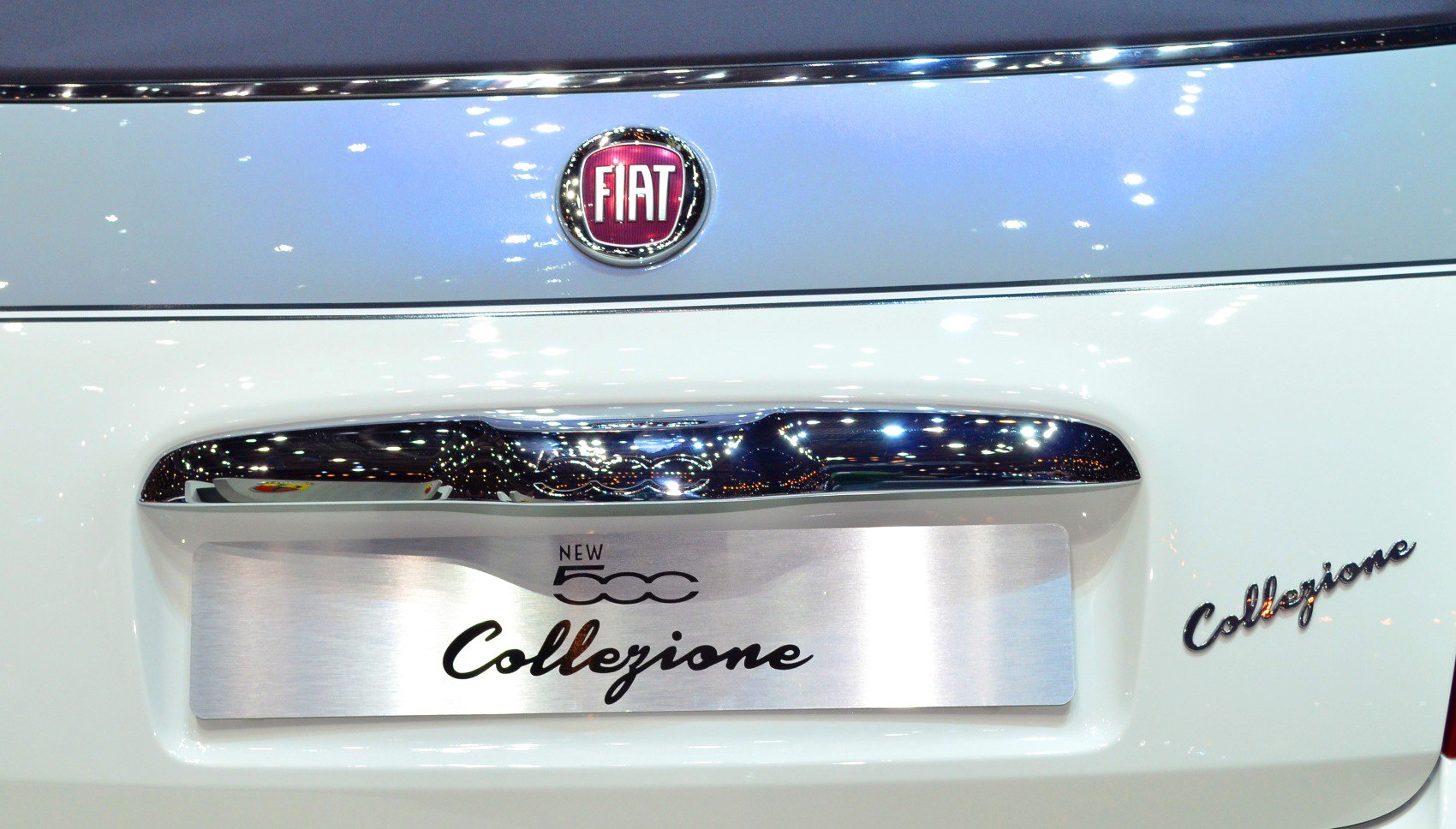 Rear badge, chrome handle, and Collezione emblem close-up