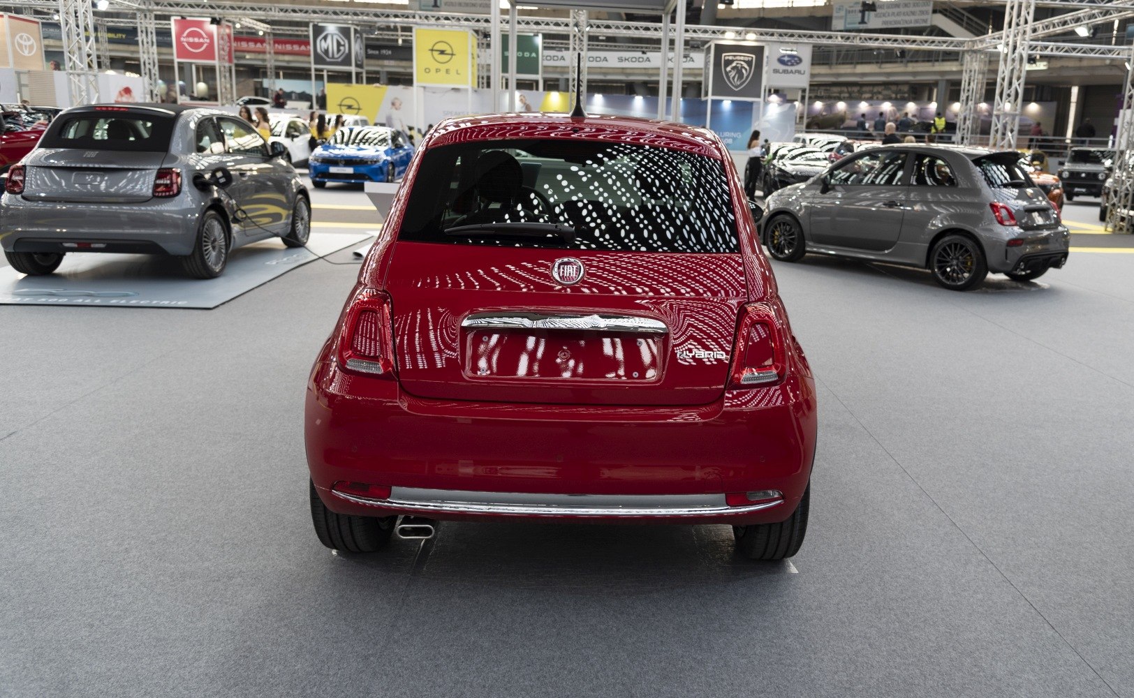 Rear view of hybrid hatchback with tail lights and badge
