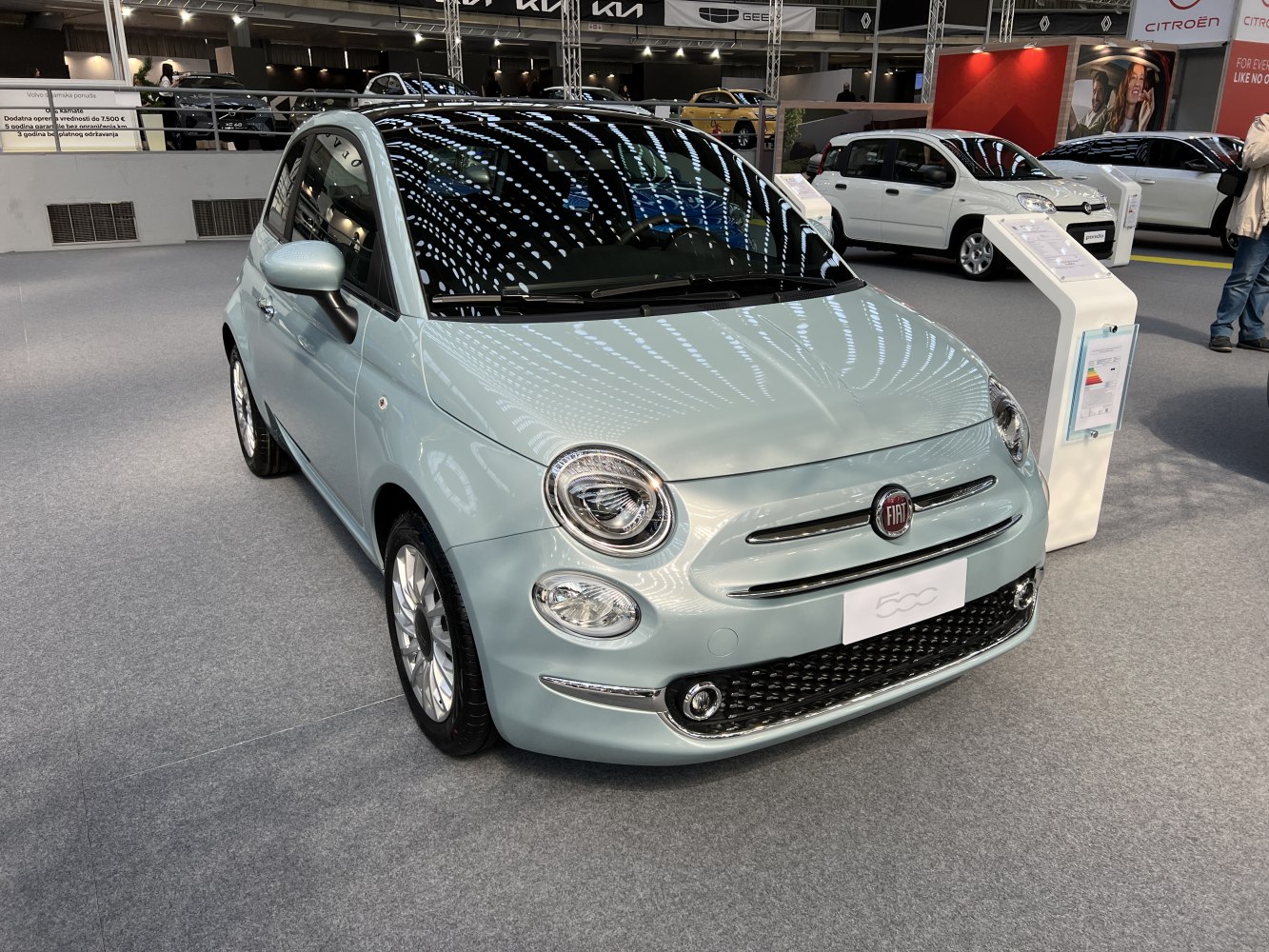 Compact hatchback front with round headlights and sleek grille