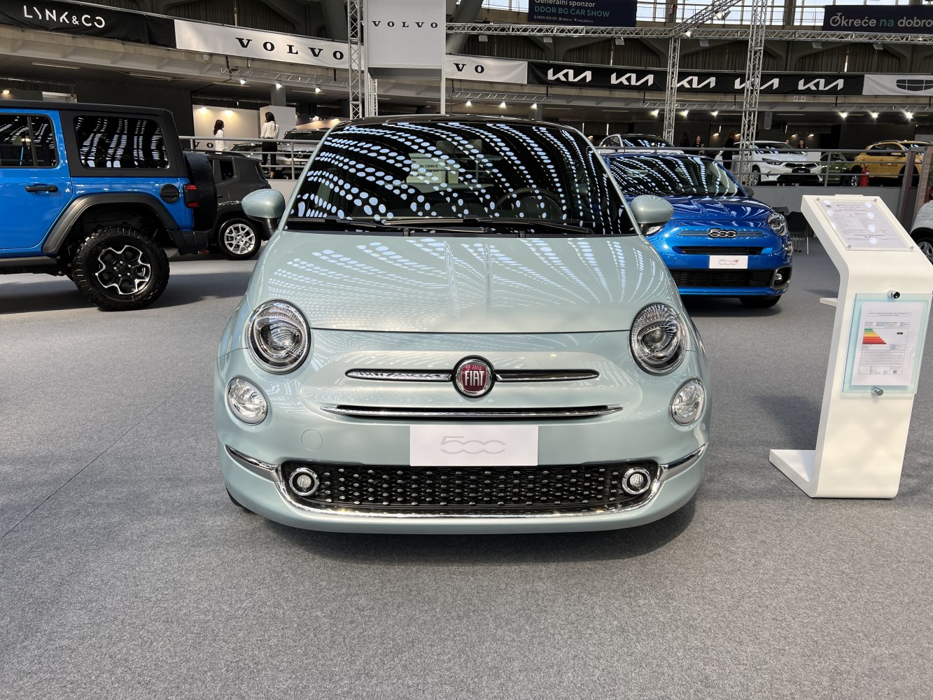 Front view with round headlights and chrome grille