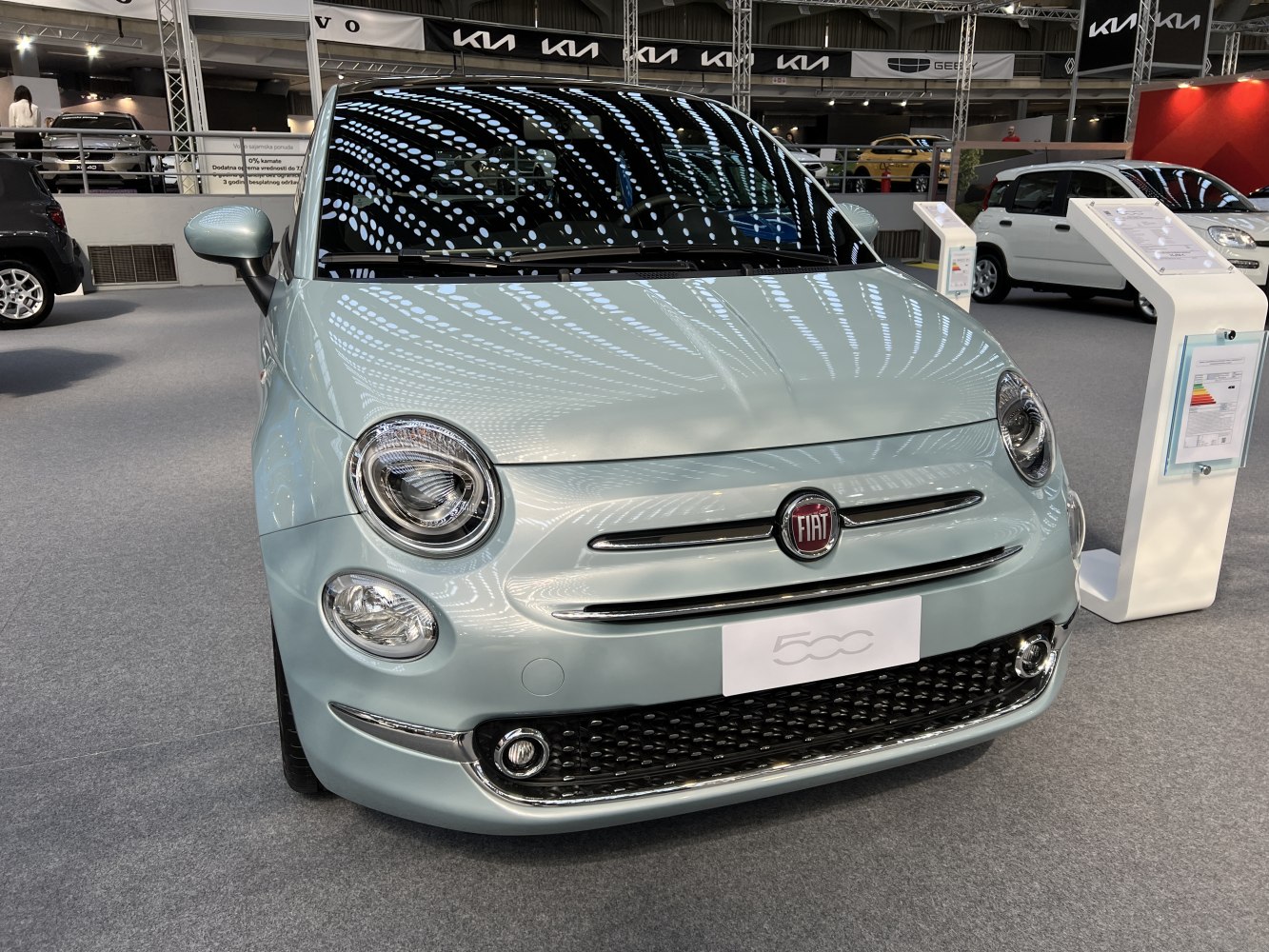 Compact front design with round headlights and grille