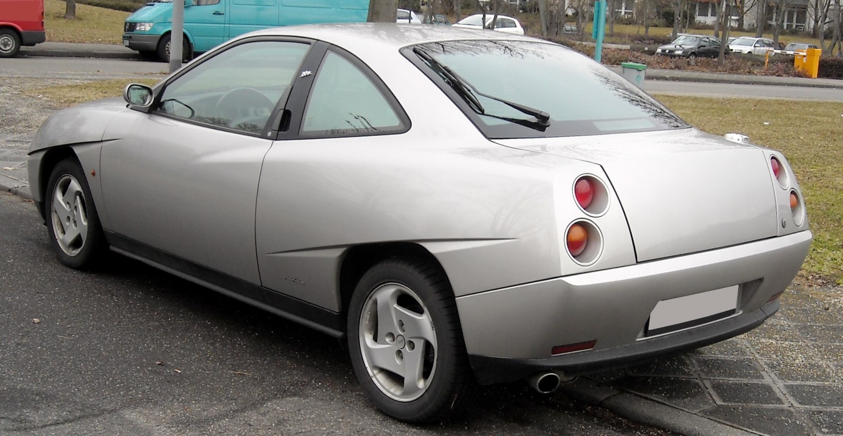 Silver coupe with distinctive round rear tail lights and angular modern body lines